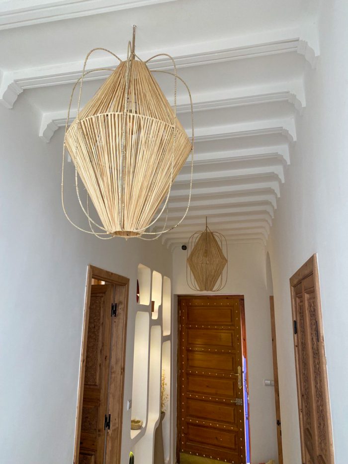Diamond raffia pendant light with sculptural handwoven cage design
