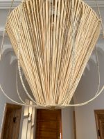 Diamond raffia pendant light with sculptural handwoven cage design
