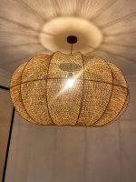 Handmade wavy raffia pendant light with ribbed pumpkin shape