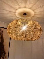 Handmade wavy raffia pendant light with ribbed pumpkin shape
