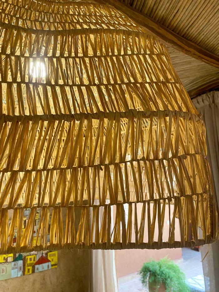 Oversized raffia pendant light with handmade Moroccan wavy dome shape