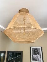 Handmade raffia pendant light with wide flared woven shape