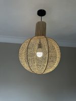 Round raffia pendant light handmade in Morocco with woven globe shape