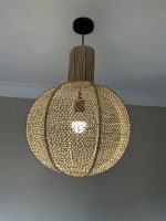 Round raffia pendant light handmade in Morocco with woven globe shape
