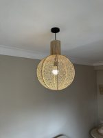 Round raffia pendant light handmade in Morocco with woven globe shape