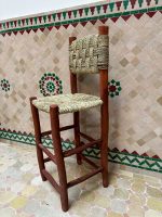 Handwoven Palm Leaf Bar Stool handcrafted from solid wood with a natural woven palm leaf seat