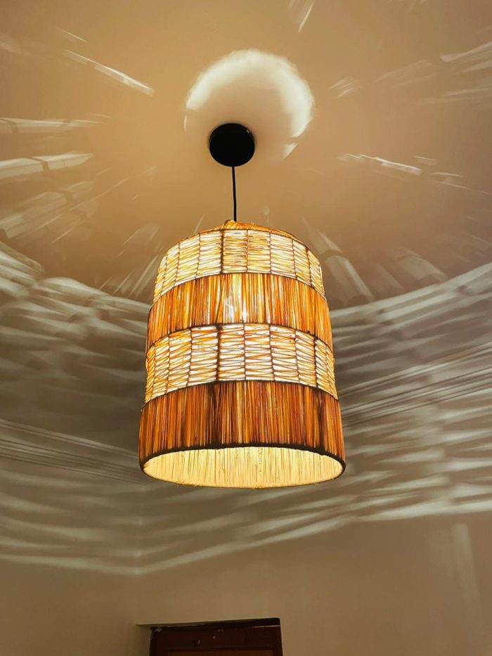 Tiered raffia pendant light with handwoven bell shaped shade