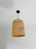 Tiered raffia pendant light with handwoven bell shaped shade