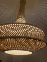 Handmade rope pendant light with long neck and tiered circular shape