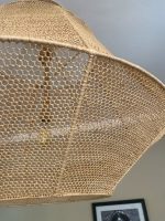 Handmade raffia pendant light with wide flared woven shape