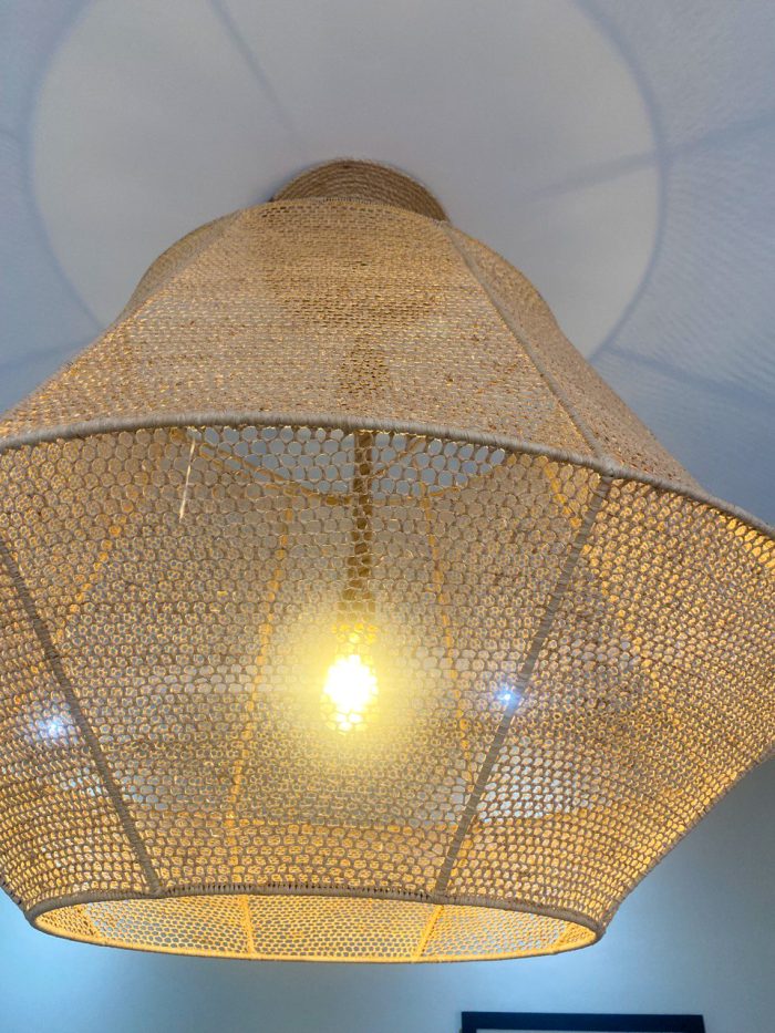 Handmade raffia pendant light with wide flared woven shape