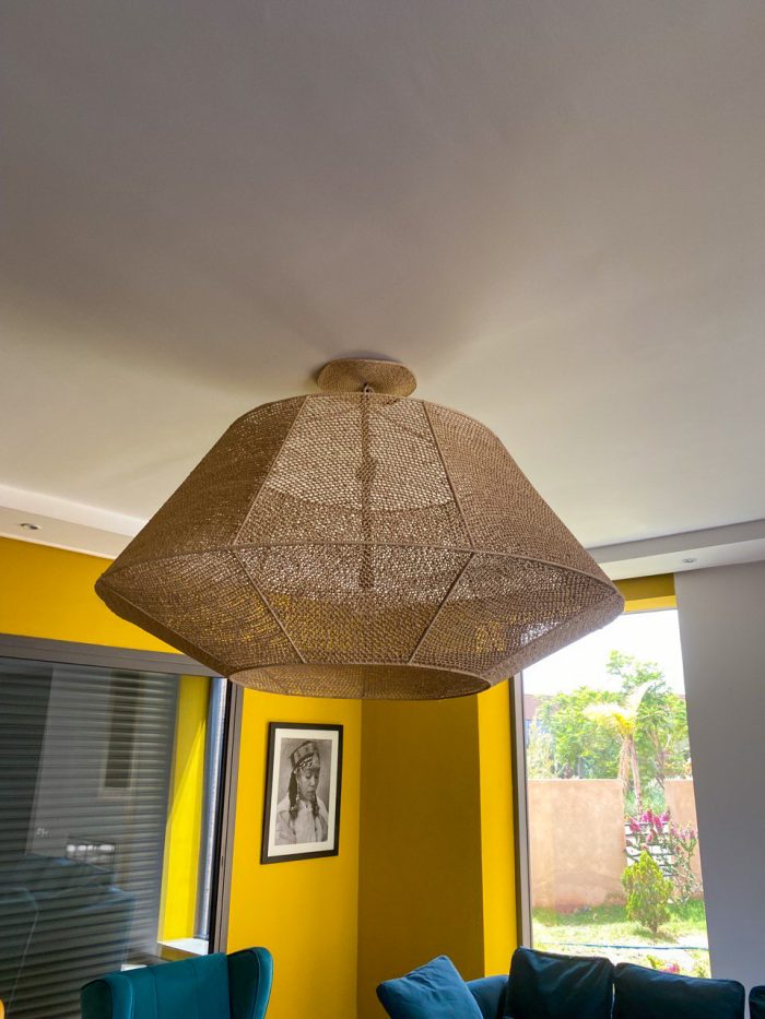 Handmade raffia pendant light with wide flared woven shape