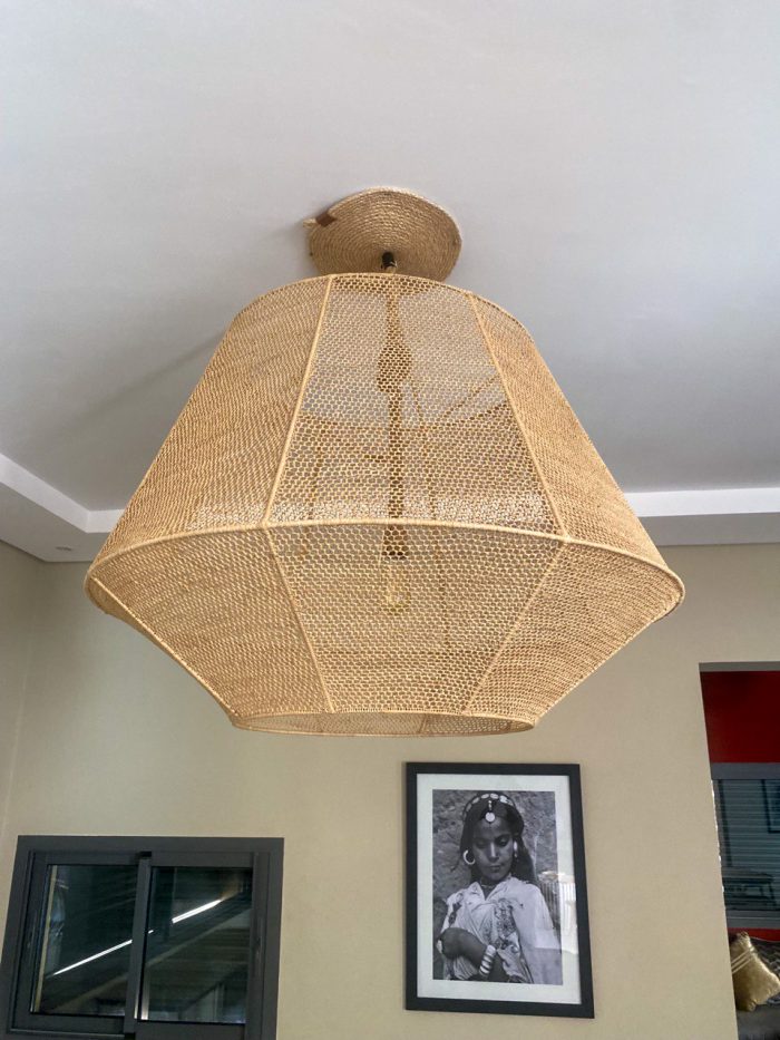 Handmade raffia pendant light with wide flared woven shape