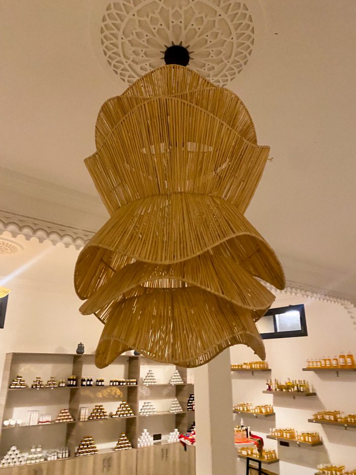 Spiral raffia pendant light with cascading handwoven layers