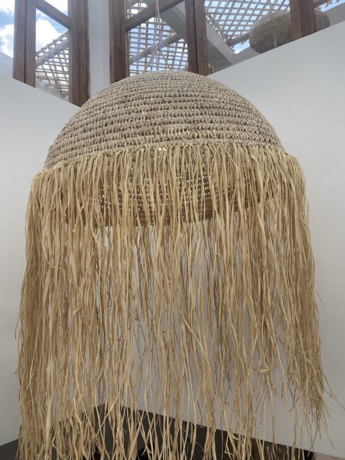 Moroccan straw ball pendant light with long natural raffia fringe