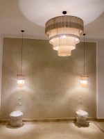 Cascading fringe chandelier with layered natural fiber drum shades