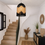 Black and natural bell raffia pendant light with geometric woven design