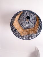 Black and natural bell raffia pendant light with geometric woven design