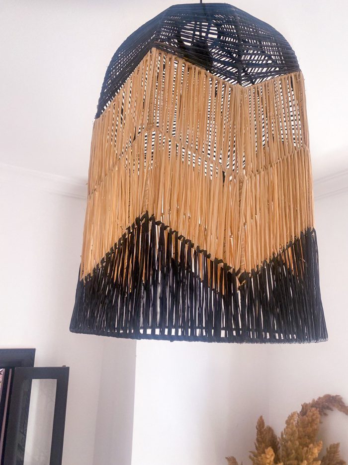Black and natural bell raffia pendant light with geometric woven design