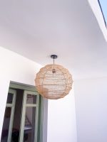 Handmade round raffia pendant light with woven globe basket shape
