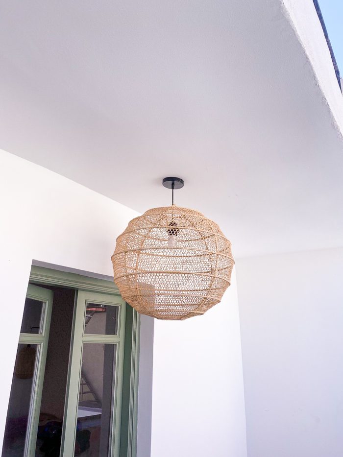 Handmade round raffia pendant light with woven globe basket shape