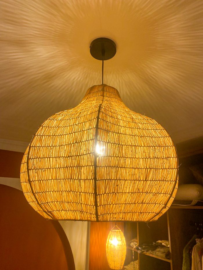 Sculptural raffia pendant light with rounded handmade Moroccan woven shade