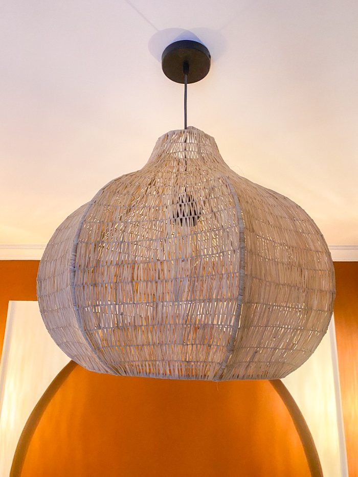 Sculptural raffia pendant light with rounded handmade Moroccan woven shade