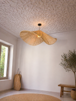 Handmade wavy raffia pendant light with sculptural woven dome shape