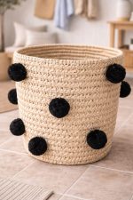 Natural Round Woven Laundry Basket with Black Pom Poms - Image 3
