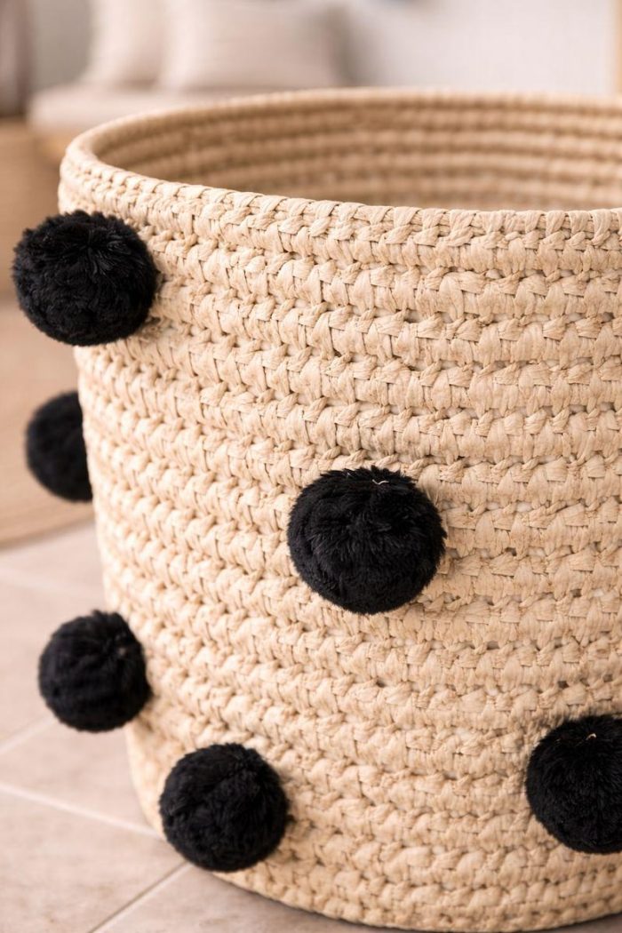 Natural Round Woven Laundry Basket with Black Pom Poms - Image 2