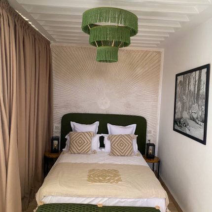 Green fringe chandelier with three tier cascading design
