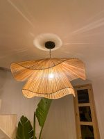 Handmade wavy flower raffia pendant light with layered natural woven petals