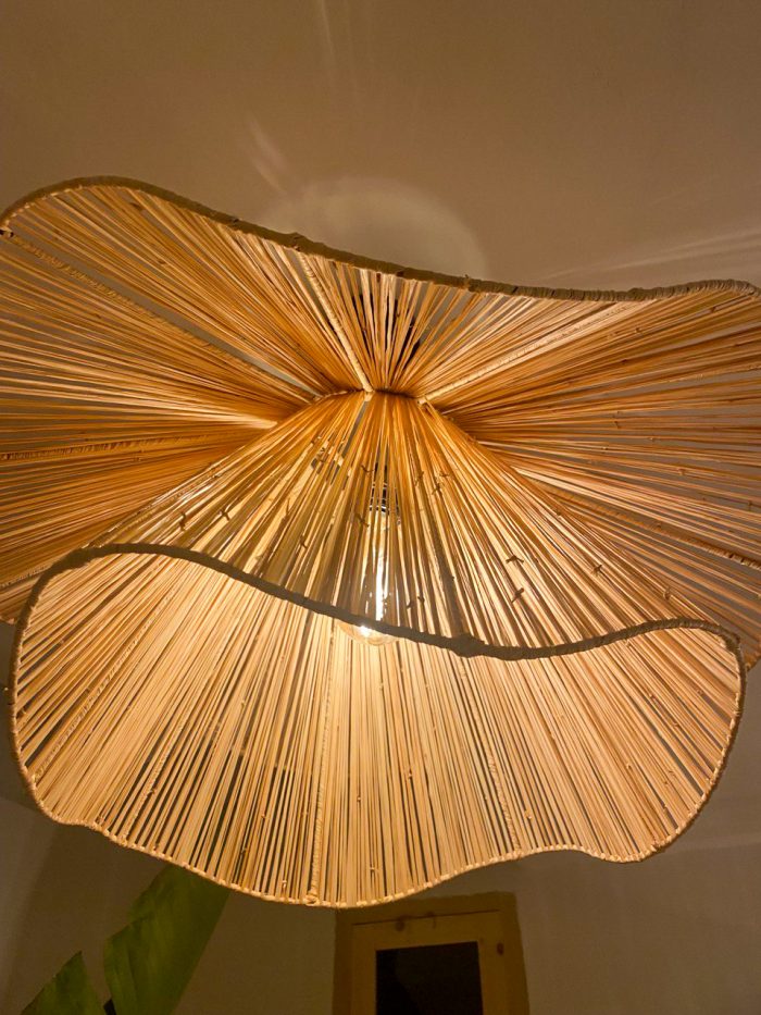 Handmade wavy flower raffia pendant light with layered natural woven petals