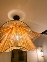 Handmade wavy flower raffia pendant light with layered natural woven petals