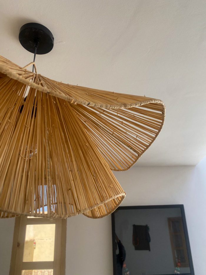 Handmade wavy flower raffia pendant light with layered natural woven petals