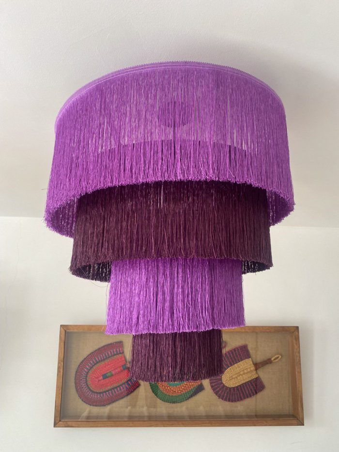 Purple fringe chandelier with cascading plum and purple tiers