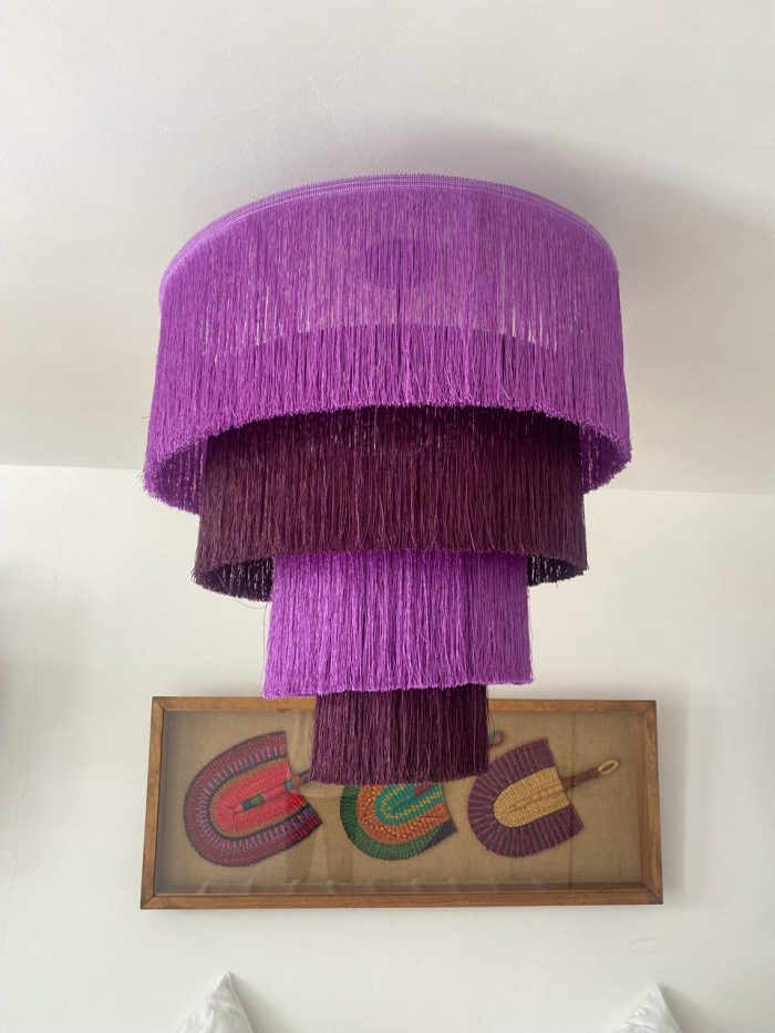 Purple fringe chandelier with cascading plum and purple tiers