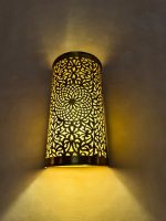 Handmade Moroccan brass wall sconce crafted from solid brass with intricate pierced detailing and warm up-and-down decorative illumination.
