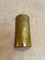 Handmade Moroccan brass wall sconce crafted from solid brass with intricate pierced detailing and warm up-and-down decorative illumination.