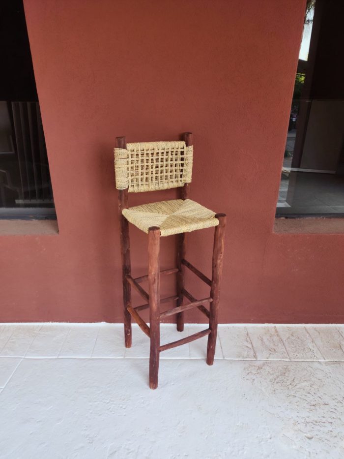 Palm Leaf Counter Stool handcrafted from solid wood with a natural handwoven palm leaf seat