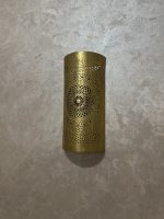 Handmade radiant rosette brass wall sconce with central geometric floral medallion and pierced decorative pattern.