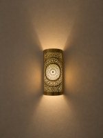 Handmade radiant rosette brass wall sconce with central geometric floral medallion and pierced decorative pattern.