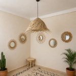 Natural Doum Straw Fringe Pendant Light handmade from woven straw and doum fibers with long flowing fringe.