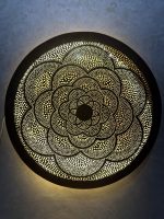 Moroccan Brass Flower Wall Light with handmade pierced rosette pattern and warm decorative glow