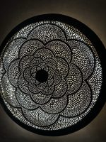 Moroccan Brass Flower Wall Light with handmade pierced rosette pattern and warm decorative glow