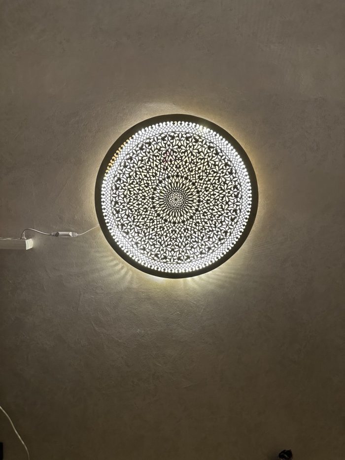 Ornate Brass Medallion Wall Light handcrafted from solid brass with intricate pierced floral detailing