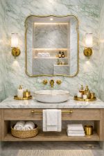 Handmade Curved Edge Brass Mirror with sculpted frame in tiled bathroom