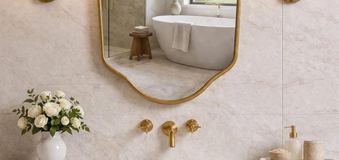 Handmade Curved Shield Brass Mirror with brass frame above wooden bathroom vanity