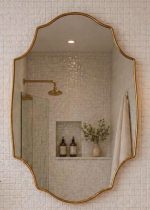 Arched Shield Brass Mirror with handmade brass frame above bathroom vanity
