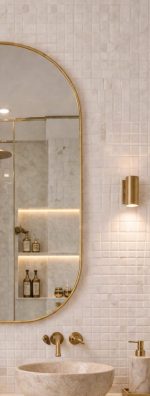Handmade rounded arch brass wall mirror with solid brass frame above a double bathroom vanity.